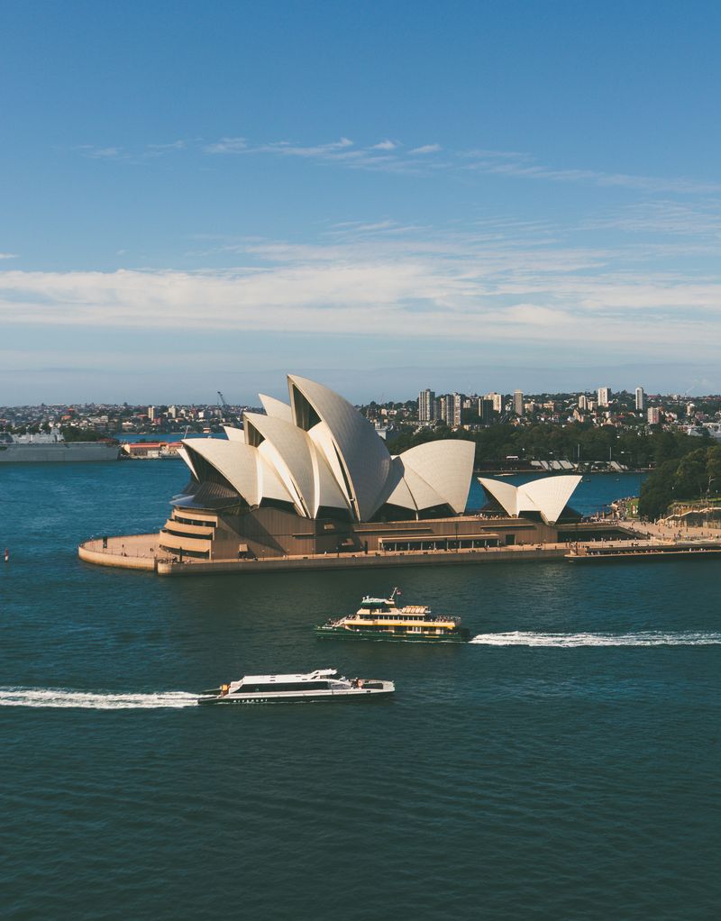 The Sydney Opera House from above, with a ferry crossing the harbour